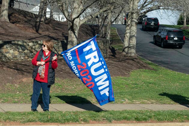 December 13, 2020, Sterling, Virginia, USA: A demonstrator shows support for United States President Donald J. Trump as he arrives at Trump National Golf Club in Sterling, VA, December 13, 2020. Credit: Pool via CNP Sterling USA - ZUMAs152 20201213_zaa_s152_004 Copyright: xChrisxKleponisx