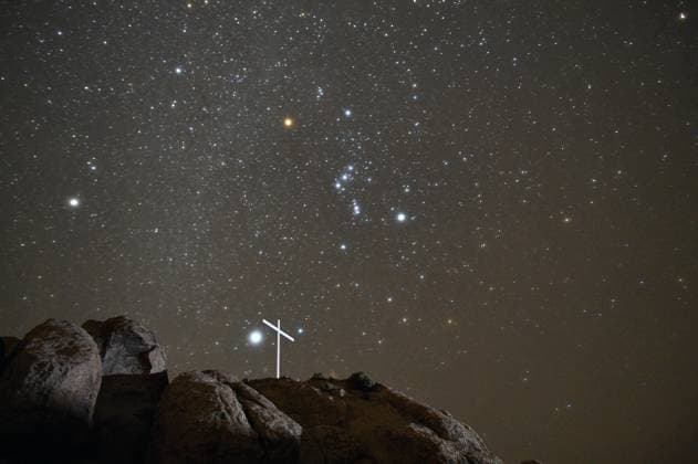 December 13, 2020 - Mojave National Preserve, California U.S. - The star constellation Orion is seen over the White Cross World War I Memorial on December 13, 2020 in the Mojave National Preserve, California. The Mojave Memorial Cross, officially known as the White Cross World War I Memorial, is a cross formerly on public land in the Mojave desert in San Bernardino County, California that was at the center of the Salazar v. Buono legal case before the U.S. Supreme Court. The original cross was erected in 1934 to honor those killed in war. Mojave National Preserve USA - ZUMAbk3_ 20201213_zaf_bk3_005 Copyright: xDavidxBeckerx