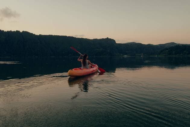 Woman sailing on boat in pure lake, Model released Copyright: xAdrianxCanox MR