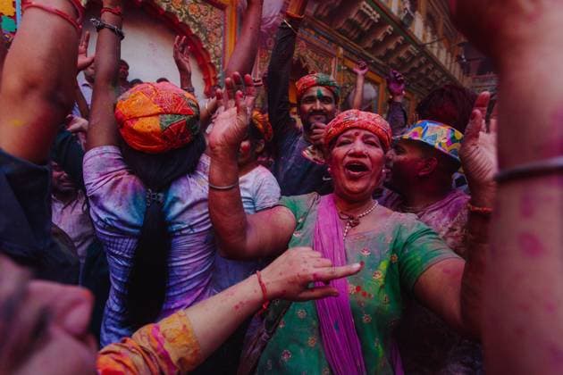 India - March 9, 2020: Group of cheerful Indian people in painted clothes having fun in city during Holi festival Copyright: xAitorxAudicanax Model Released