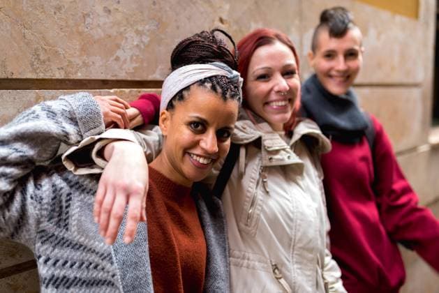 Stylish multiracial friends standing in street and looking at camera, Model released Copyright: xAlbertoxMenendezx MR