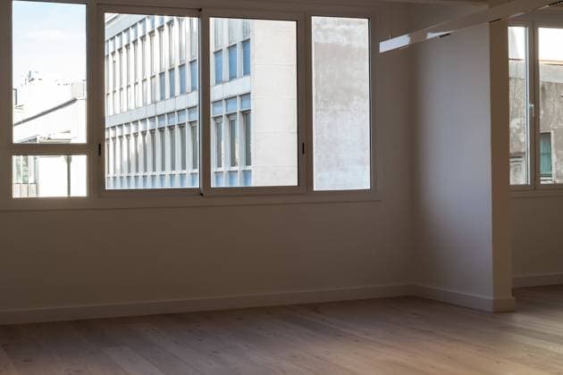 Huge windows and white walls inside spacious empty room of modern apartment Copyright: xCristinaxGarciax Model Released