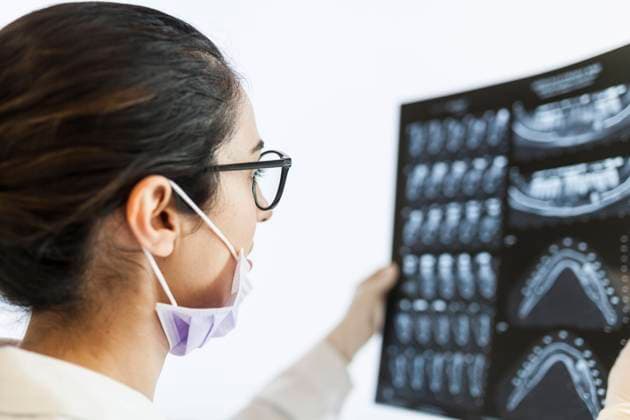 female dentist reviewing the patient s x-ray, Model released Copyright: xDavidxFuentesx MR