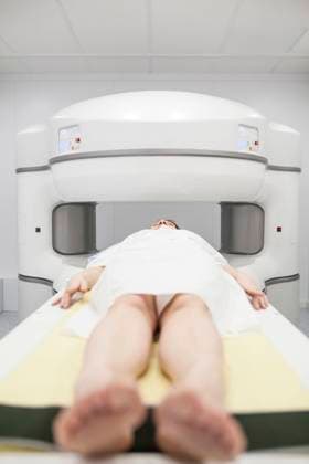middle-aged woman on an open MRI machine waiting for the test to begin, Model released Copyright: xDavidxFuentesx MR