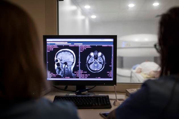 Doctors baling the MRI test in the control room, Model released Copyright: xDavidxFuentesx MR