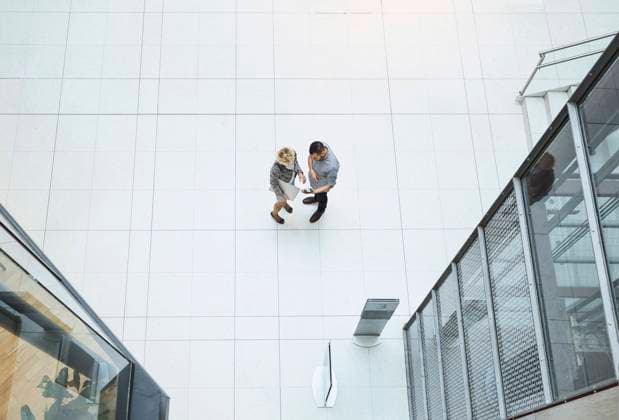 High angle view of business colleagues using digital tablet in modern office , model released Copyright: xMaskotx , MA43923