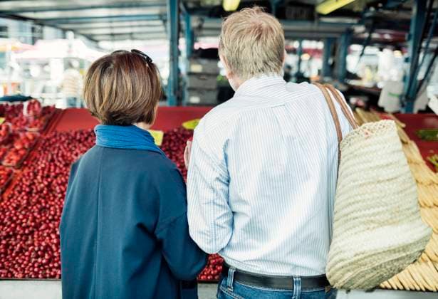 Rear view of senior couple buying fruits at market , model released Copyright: xMaskotx , MA45747