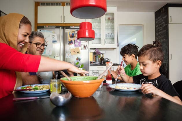 Happy family having meal at dining table , model released, property released Copyright: xMaskotx , MA51734