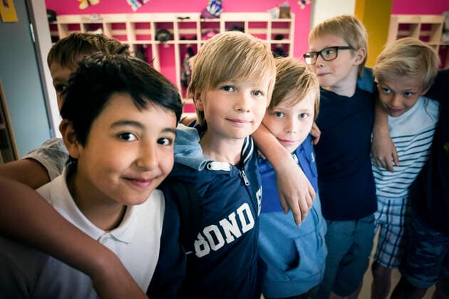 Portrait of happy boys standing in school corridor , model released, property released Copyright: xMaskotx , MA52015