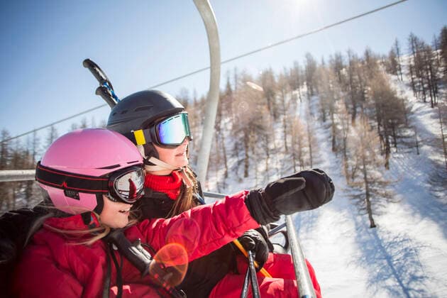 Mother and daughter enjoying while traveling in ski lift , model released Copyright: xMaskotx , MA53774