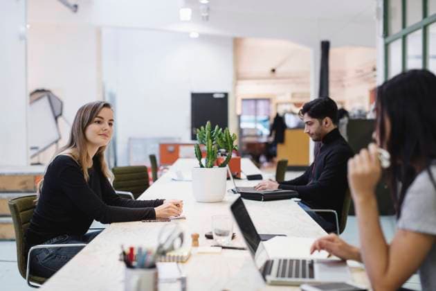 People discussing at desk in creative office , model released, property released Copyright: xMaskotx , MA54533