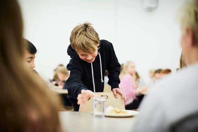 Boy picking up glass of drinking water in school cafeteria , model released, property released Copyright: xMaskotx , MA55001