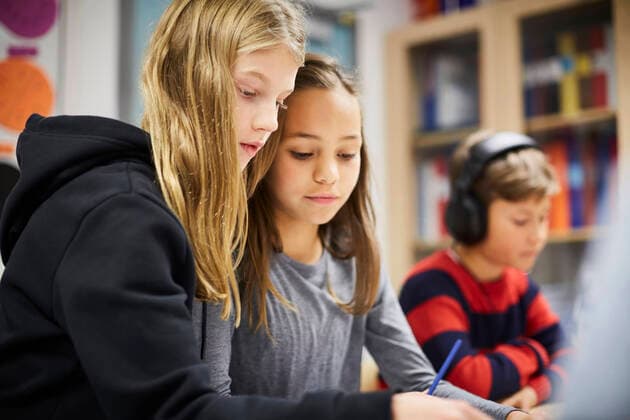 Girls studying together in classroom , model released, property released Copyright: xMaskotx , MA55021