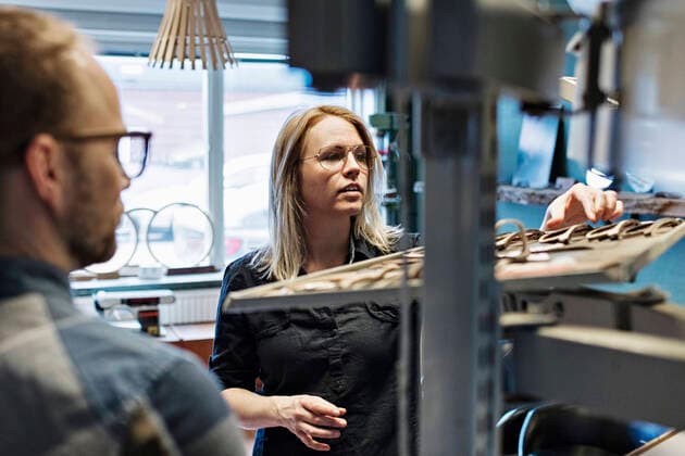 Couple working at eyeglasses workshop , model released, property released Copyright: xMaskotx , MA55272