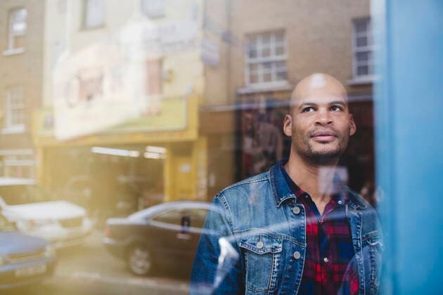 Thoughtful mid adult man in coffee shop seen through window , model released Copyright: xMaskotx , MA55317