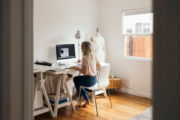 Full length rear view of graphic designer using computer at home , model released, property released Copyright: xMaskotx , MA56101