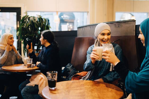 Happy female friends enjoying drinks at cafe , model released Copyright: xMaskotx , MA62103