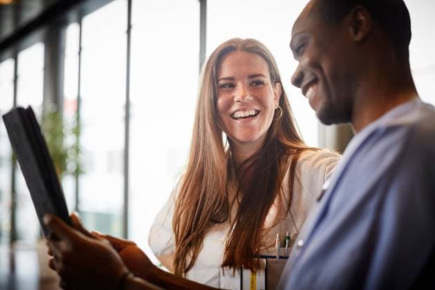 Smiling nurses discussing over digital tablet in corridor at hospital , model released, property released Copyright: xMaskotx , MA65359