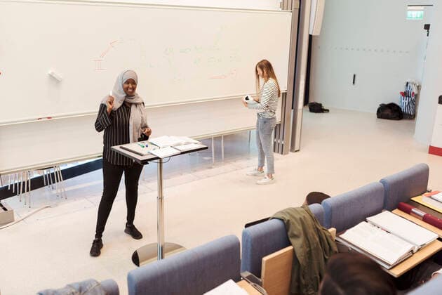 High angle view of female students giving presentation in auditorium during rehearsal at university , model released, property released Copyright: xKentarooxTrymanx , MA68342