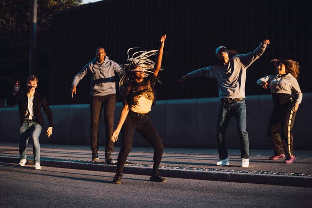 Full length of multi-ethnic male and female friends dancing on sidewalk in city , model released Copyright: xMaskotx , MA68461
