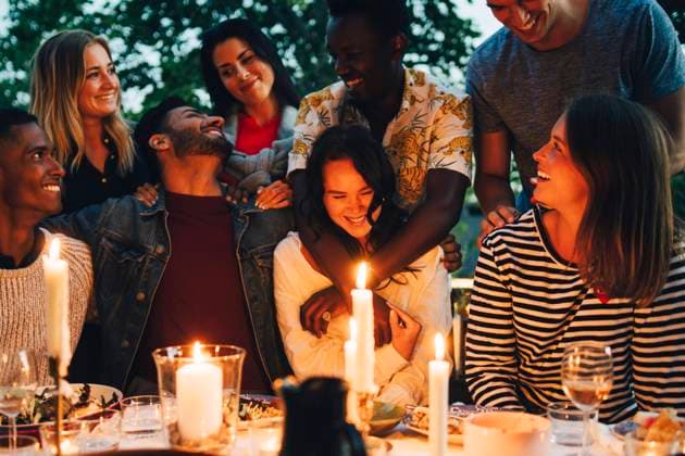 Cheerful multi-ethnic male and female friends enjoying dinner party , model released, property released Copyright: xMaskotx , MA70319