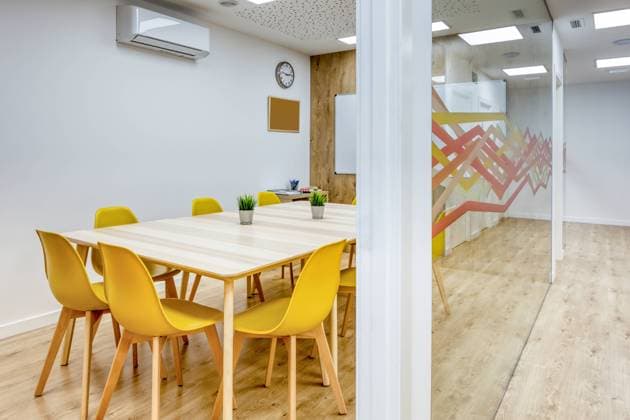 Light corridor with wooden floor among glass walls of light modern cozy office conference zones with comfortable yellow chairs at big wooden tables Copyright: xJavierxBallesterx Model Released