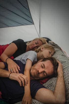Family sleeping with closed eyes in tent during camping , model released, property released Copyright: xMaskotx , MA74518