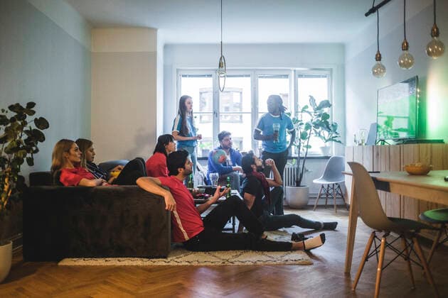 Male and female fans watching soccer match in living room , model released, property released Copyright: xMaskotx , MA77365