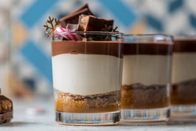 Yummy vanilla and chocolate dessert in glass cup decorated with Christmas items Copyright: xJayxMidx Model Released