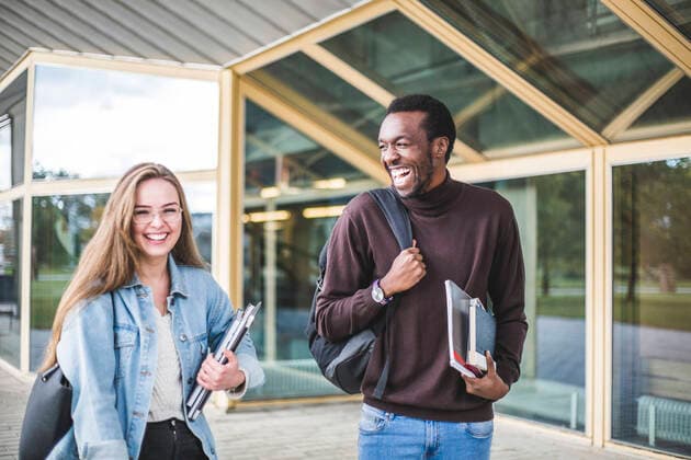 Happy male and female students at university Sweden, Stockholm, model released, property released Copyright: xMaskotx , MA79941