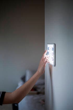 Cropped image of boy using digital tablet mounted on wall at home Sweden, Stockholm, model released, property released Copyright: xMaskotx , MA80390