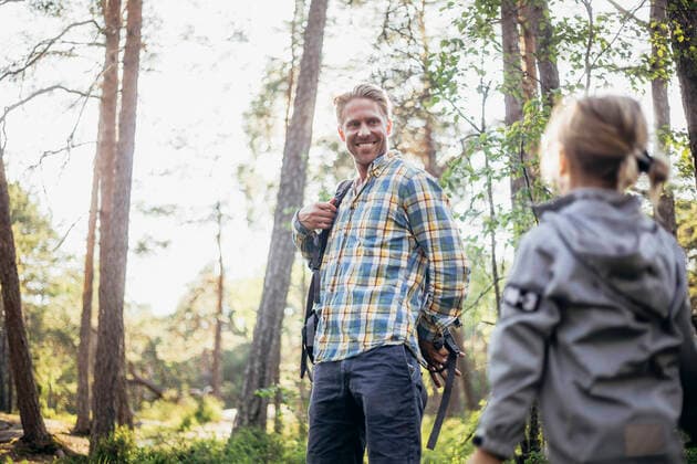 Smiling father looking at daughter in forest Sweden, Stockholm, model released Copyright: xMaskotx , MA81548