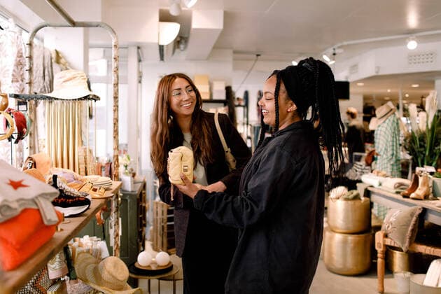Happy friends shopping at retail store Sweden, Stockholm, model released, property released Copyright: xMaskotx , MA81783