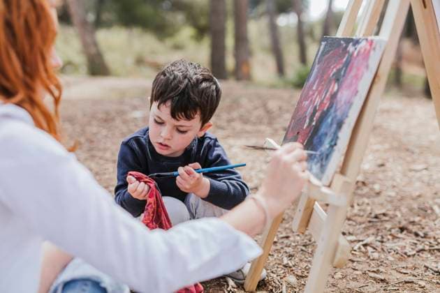Mother and boy painting near lake Copyright: xLuisxManuelxMatiasx Model Released