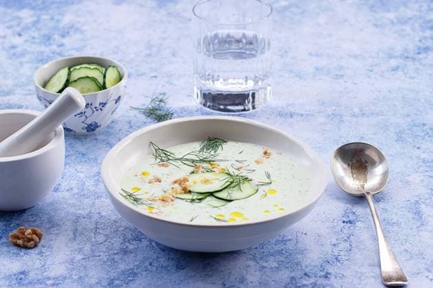 From above cold cucumber and dill soup named Tarator on rustic table Copyright: xOlgaxVilax Model Released