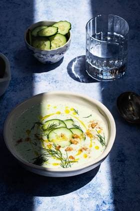 From above cold cucumber and dill soup named Tarator on rustic table with shadow Copyright: xOlgaxVilax Model Released