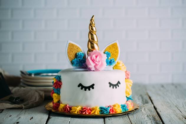 Cute unicorn cake with painted closed eyes, Model released Copyright: xRamonxLopezx MR