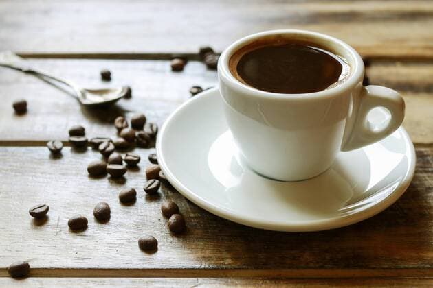 Cup of coffee on brown wooden table, copy space.  BEW1D80D96A