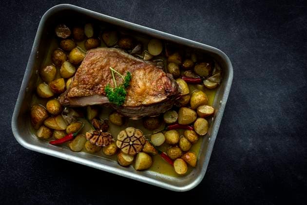 From Above a roast lamb with potatoes Copyright: xEduardoxLopezx Model Released