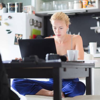 Female freelancer working from home. Female freelancer in her casual home clothing working remotly from her dining table in the morning. Home kitchen in the background., model releasedfreelance, business woman, business, home, work, freelancer, casual, home office, multitasking, morning, coffee, kitchen, smarth phone, manage, office, woman, lifestyle, computer, businesswoman, person, workspace, workplace, female, remotely, technology, professional, beautiful, modern, entrepreneur, domestic, house, confident, laptop, notebook, creative, homework, student, young, independent, relaxed, communicating, room, dining table, cup of coffee, communication, phone, lady, caucasian, looking, cup,
