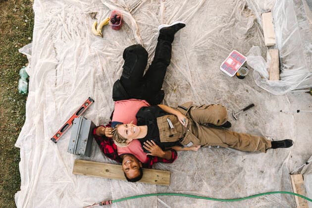High angle view of smiling woman resting on partner after renovating during summer Sweden, Stockholm, model released, property released Copyright: xMaskotx , MA83124