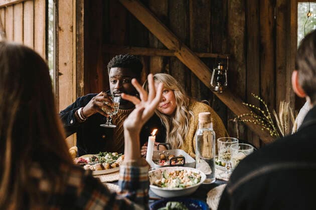 IMAGO Creative: Landleben - Essen Rear view of woman gesturing while female resting head on friend s shoulder during social gathering Sweden, Stockholm, model released, property released Copyright: xMaskotx , MA83268