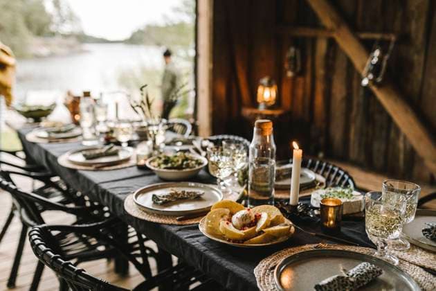 Food in plate by drinking glass arranged on table during social event Sweden, Stockholm, model released, property released Copyright: xMaskotx , MA83292