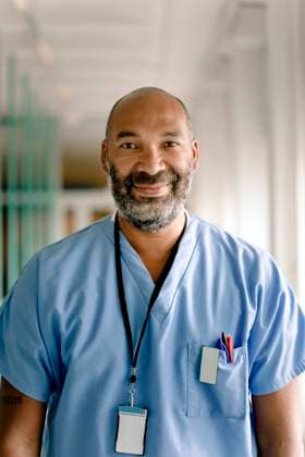 Portrait of smiling male nurse in hospital corridor Sweden, Stockholm, model released, property released Copyright: xMaskotx , MA83370