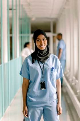 Portrait of smiling female nurse standing in hospital corridor Sweden, Stockholm, model released, property released Copyright: xMaskotx , MA83371