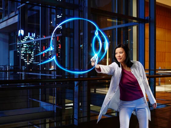 Mature female ophthalmologist light painting in laboratory at hospital model released Symbolfoto property released RORF02514