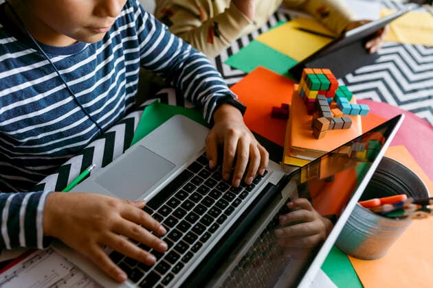 Boys using laptop while e-learning at home model released Symbolfoto property released VABF04038