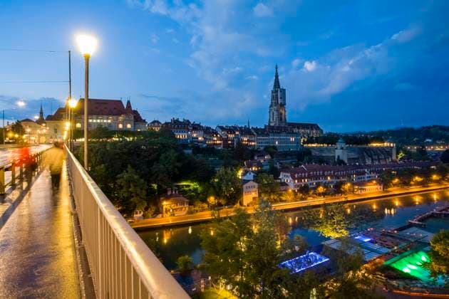 Switzerland, Canton of Bern, Bern, Kirchenfeldbrucke at dusk with Bern Minster in background WDF06411