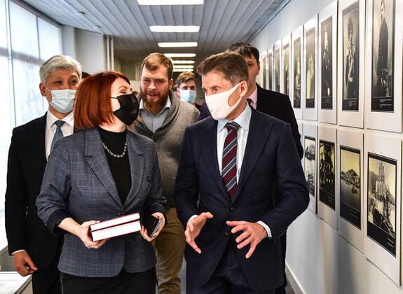 VLADIVOSTOK, RUSSIA - DECEMBER 26, 2020: Primorye Territory Governor Oleg Kozhemyako (R front) attends the opening of the Russia - My History multimedia historical park. Yuri Smityuk TASS  TS0F2FA7