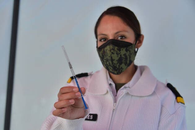 Mexico: Vaccination against Covid-19 MEXICO CITY, MEXICO - DECEMBER 30: A nurse holds the Pfizer-BioNTech COVID-19 vaccine during the vaccinations against Covid for health workers at tents installed for the vaccination campaign of Covid-19 inside Military Camp 1A on December 30, 2020 in Mexico City, Mexico **World Rights ** Mexico City Mexico Copyright: CarlosxTischler